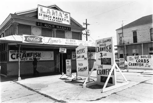 Lama's St. Roch Market Seafoods in 1970s New Orleans, with hand-painted crawfish and oyster signs on St. Claude Avenue