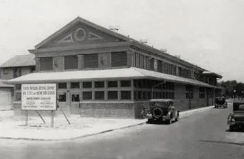 St. Roch Market New Orleans after the 1937-38 WPA renovations on St. Claude Avenue, with period automobiles out front