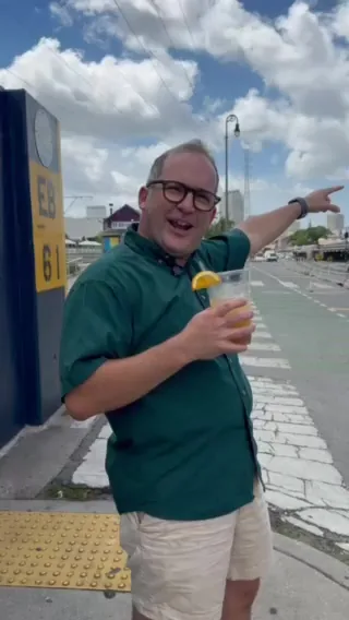 Kevin Pedeaux holding a Zanzibar Boogie frozen cocktail go-cup